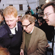 Above: Protected by police, Woody Allen arrives at the premiere of his new film.